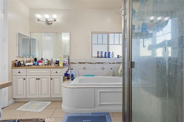 bathroom featuring vanity, shower with separate bathtub, and tile patterned flooring