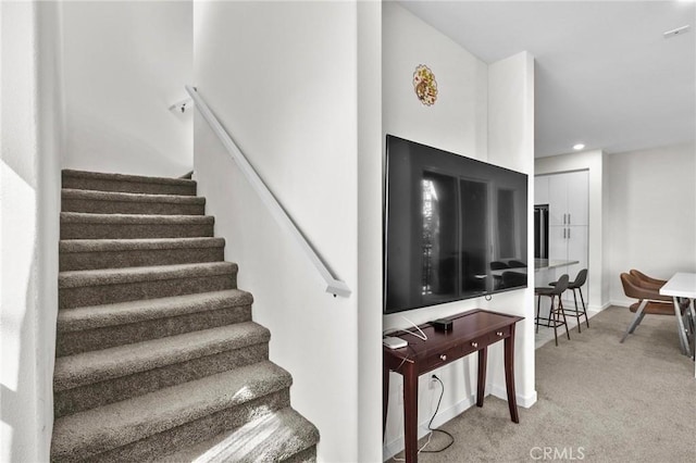 stairway with carpet floors