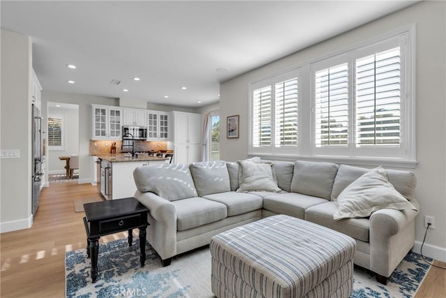 living room featuring light wood-type flooring