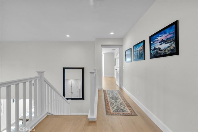 hallway with light hardwood / wood-style flooring