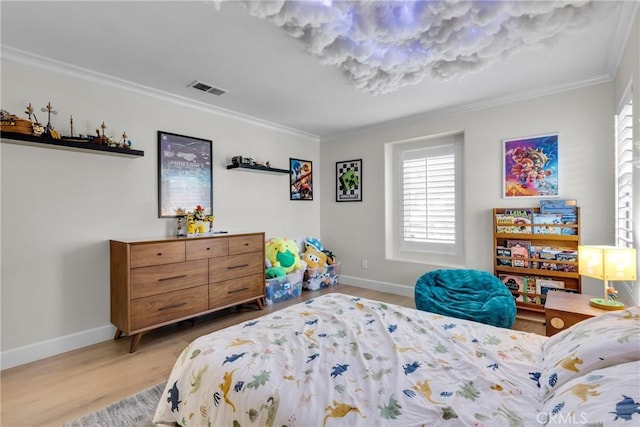 bedroom featuring light wood-type flooring and ornamental molding