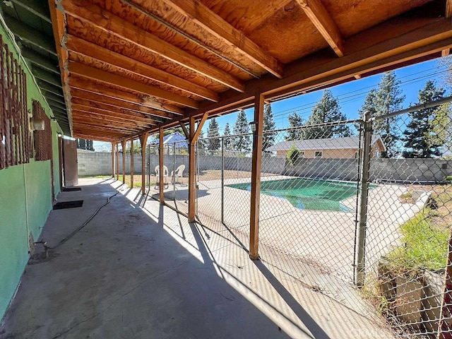 view of patio with a fenced in pool