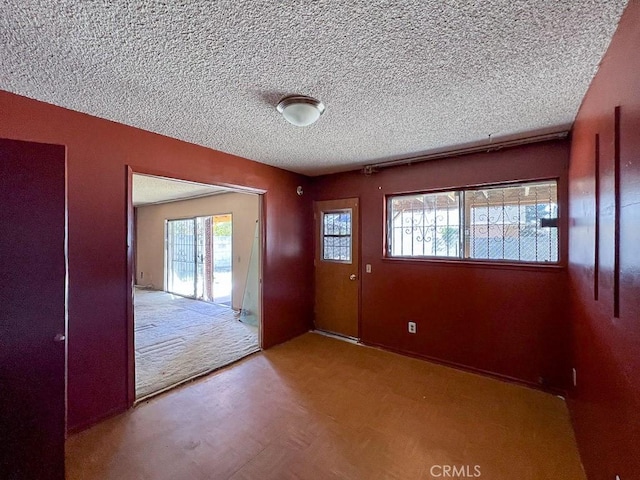 foyer featuring a healthy amount of sunlight and a textured ceiling