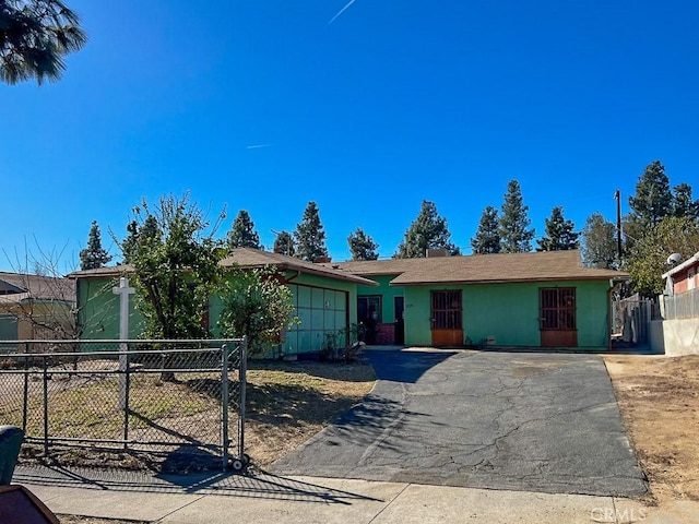 ranch-style house featuring a garage