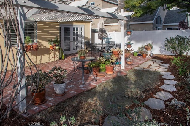 view of patio / terrace featuring a pergola and french doors