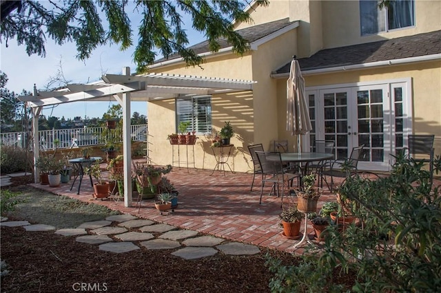 view of patio with a pergola and french doors