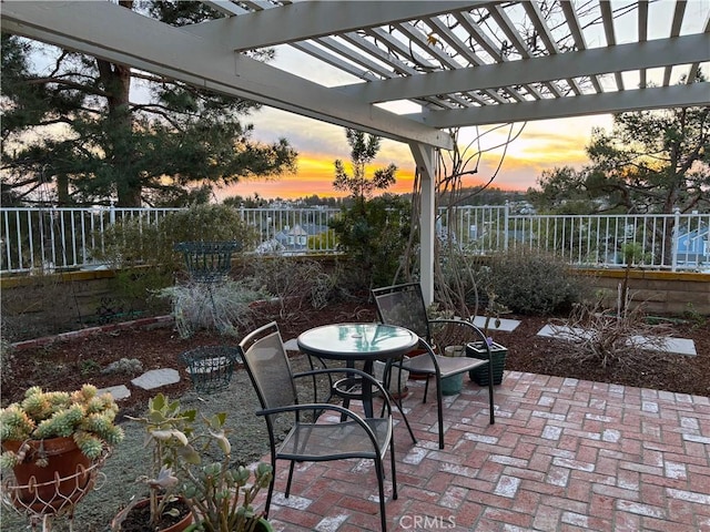 patio terrace at dusk with a pergola