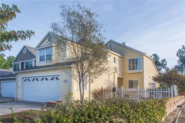 front of property with a garage