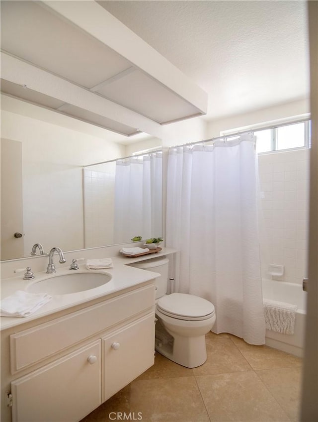 full bathroom with shower / tub combo with curtain, vanity, toilet, and tile patterned flooring