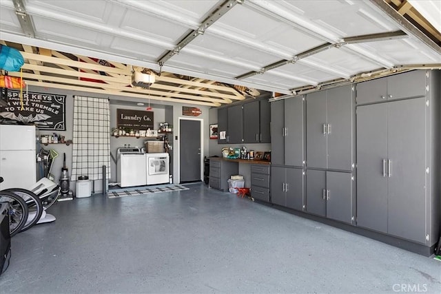 garage featuring a garage door opener and washer and clothes dryer