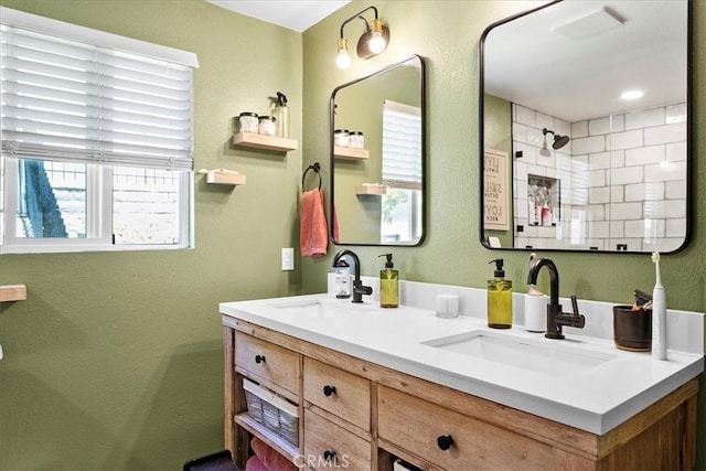 bathroom with vanity and walk in shower