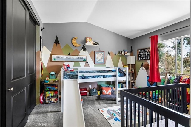 bedroom with carpet flooring and vaulted ceiling