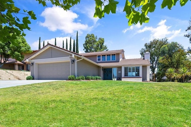 view of front of house with a garage and a front lawn