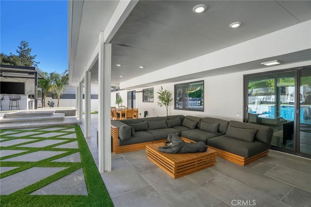 living room featuring concrete flooring