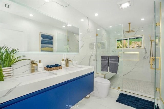 bathroom with toilet, vanity, and walk in shower