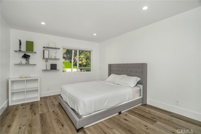 bedroom featuring hardwood / wood-style flooring