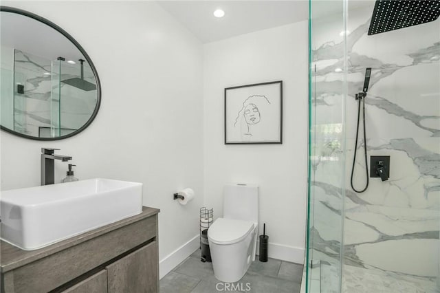 bathroom with toilet, a shower with door, and vanity