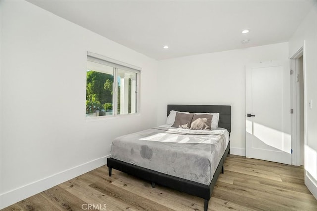 bedroom with light hardwood / wood-style flooring