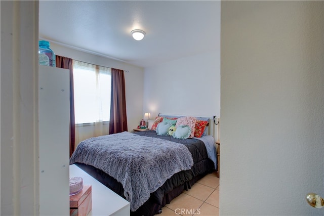 bedroom featuring light tile patterned floors