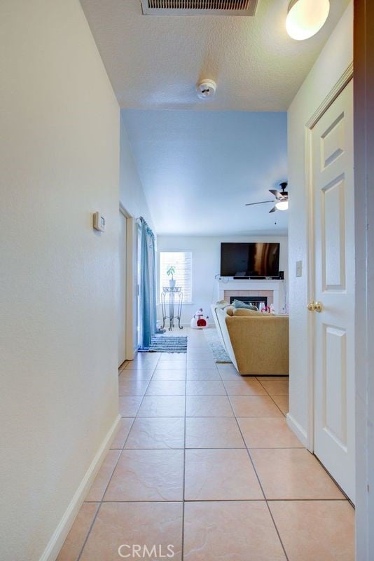 hallway featuring light tile patterned flooring