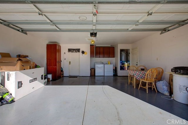 garage featuring washing machine and dryer and a garage door opener