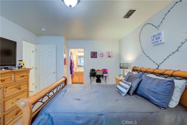 bedroom featuring ensuite bath