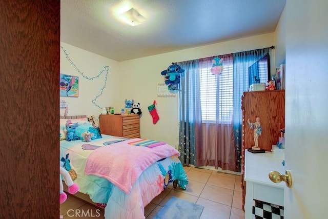 bedroom featuring light tile patterned floors