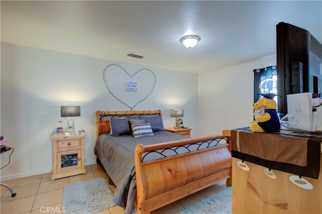 bedroom featuring light tile patterned floors