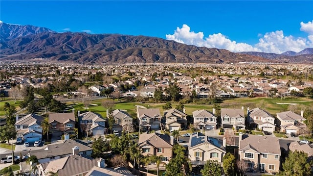 birds eye view of property with a mountain view