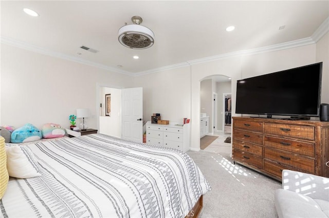 bedroom featuring crown molding and light colored carpet