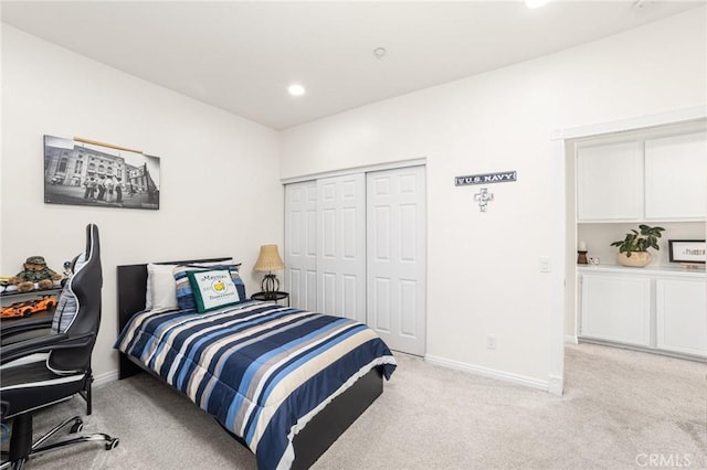 carpeted bedroom with a closet