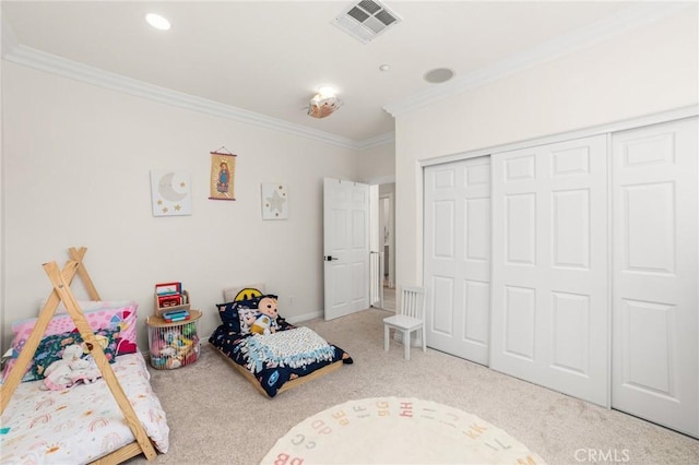 bedroom featuring a closet, carpet floors, and ornamental molding