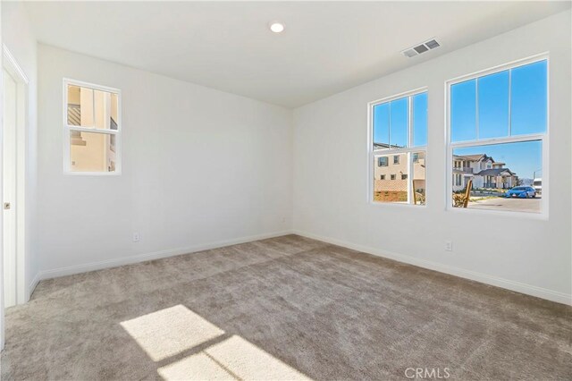 unfurnished room with carpet floors