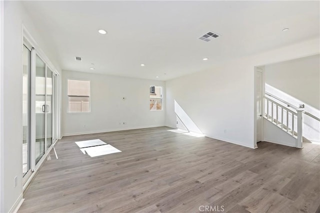 spare room with light hardwood / wood-style floors