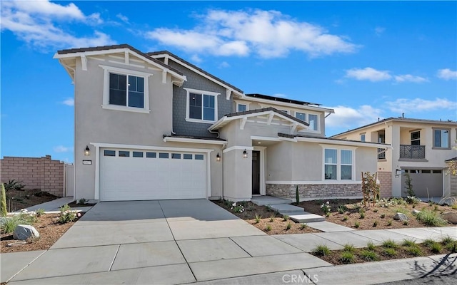 view of front of house featuring a garage and solar panels