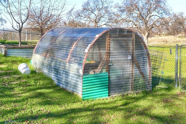 view of outbuilding featuring a yard