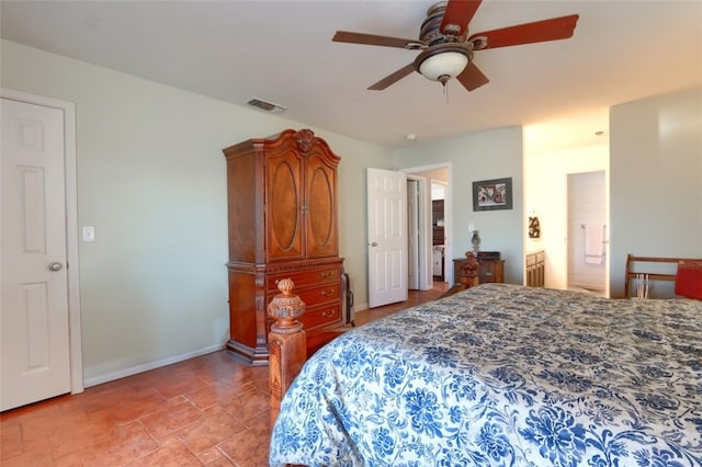 bedroom featuring ceiling fan and ensuite bath