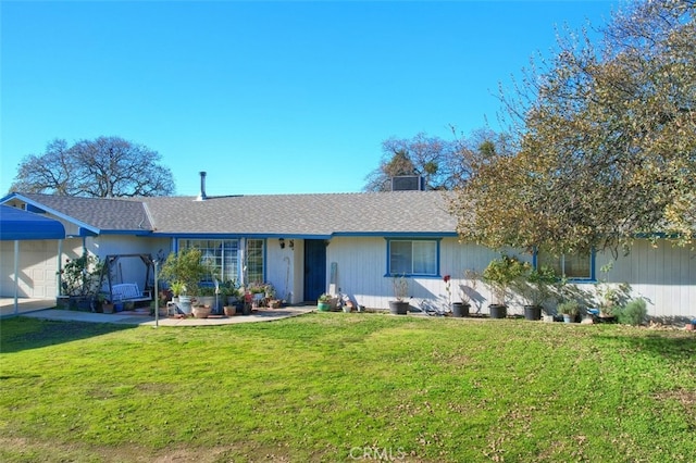 single story home featuring a garage and a front lawn