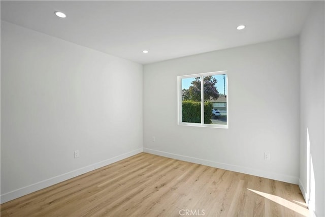 unfurnished room featuring light hardwood / wood-style flooring