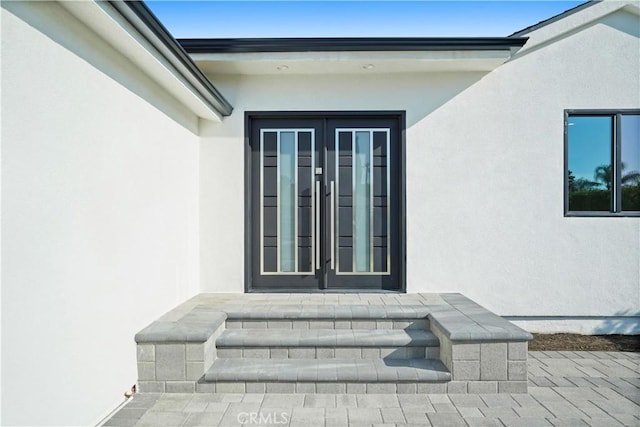 entrance to property featuring french doors