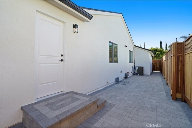 exterior space with a patio area and central AC unit