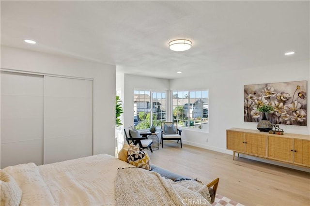 bedroom featuring a closet and light hardwood / wood-style floors