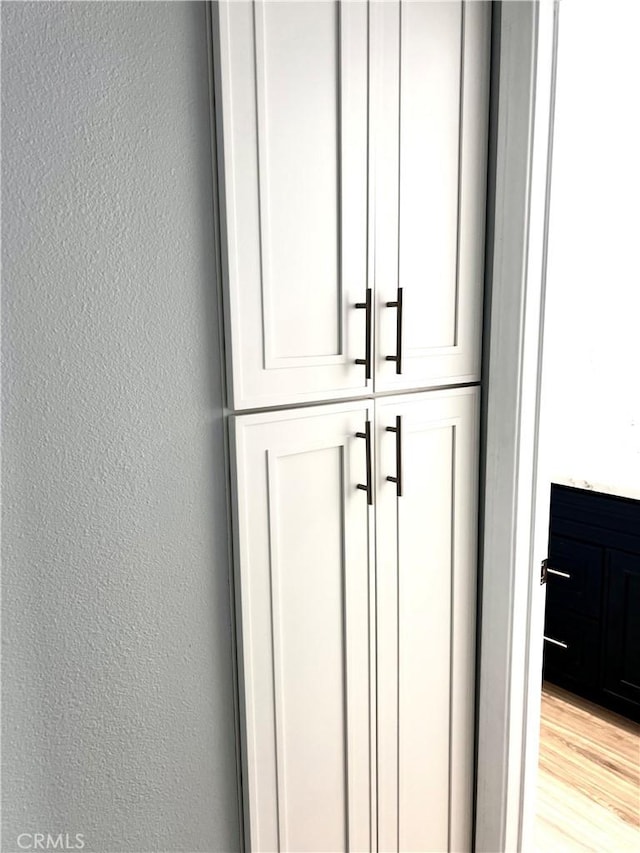 2328 Via Mariposa W Unit B, Laguna Woods, CA 92637 - interior details with a textured wall and wood finished floors