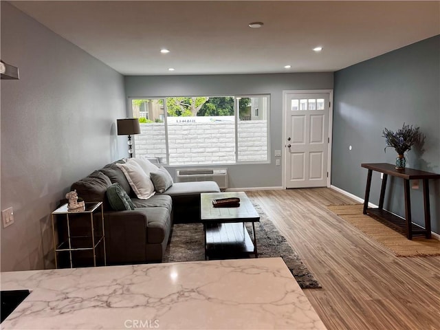2328 Via Mariposa W Unit B, Laguna Woods, CA 92637 - living area with an AC wall unit, baseboards, recessed lighting, and wood finished floors