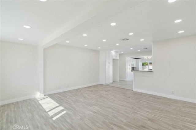 unfurnished living room featuring light wood-type flooring