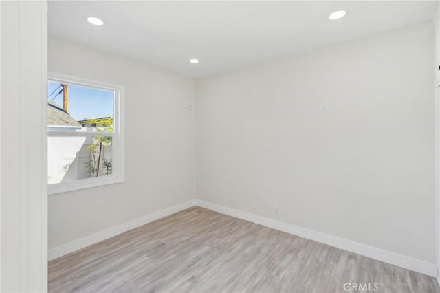 spare room featuring light wood-type flooring