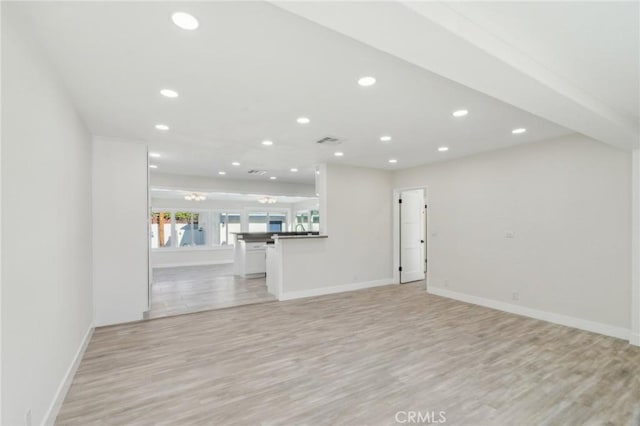 unfurnished living room with light wood-type flooring