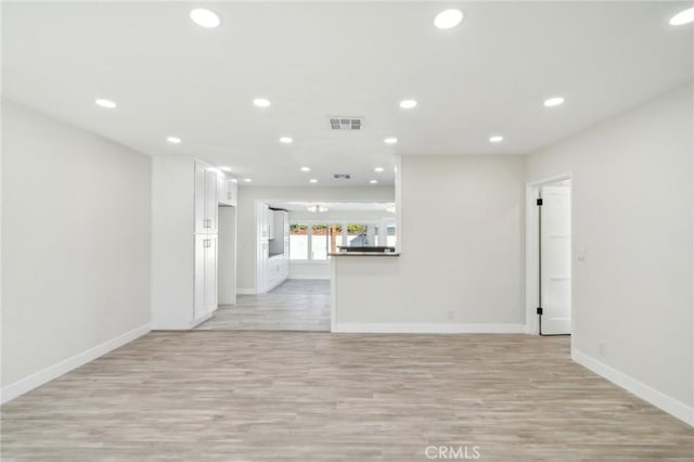 unfurnished living room featuring light hardwood / wood-style flooring