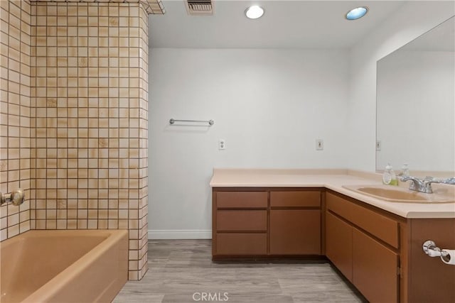 bathroom with hardwood / wood-style floors and vanity