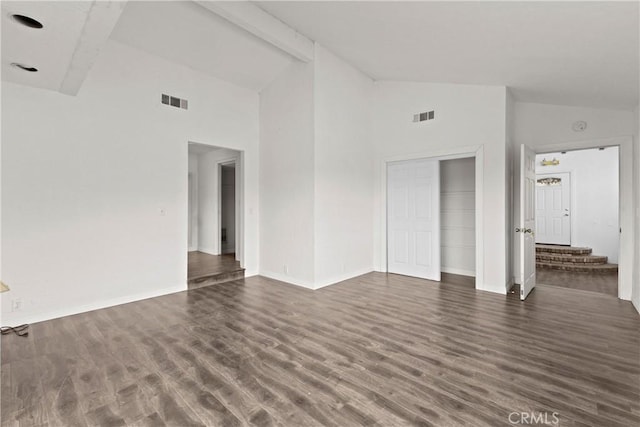 unfurnished room with beam ceiling, dark hardwood / wood-style flooring, and high vaulted ceiling